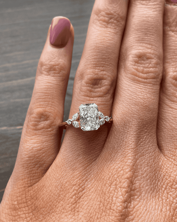 A person shows off a sparkling diamond ring from Winter Jewelry, highlighting its beauty and unique custom design.