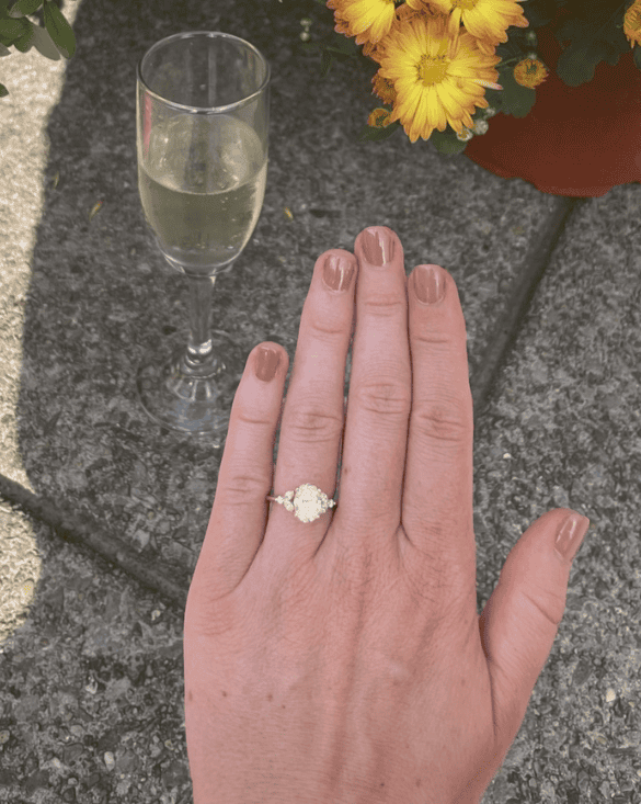 A person shows off a shiny diamond ring from Winter Jewelry, sharing a joyful moment that feels special and exciting.