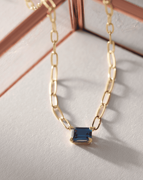 Winter Jewelry necklace with a blue rectangular gemstone shows beauty and elegance, reflecting quality craftsmanship.