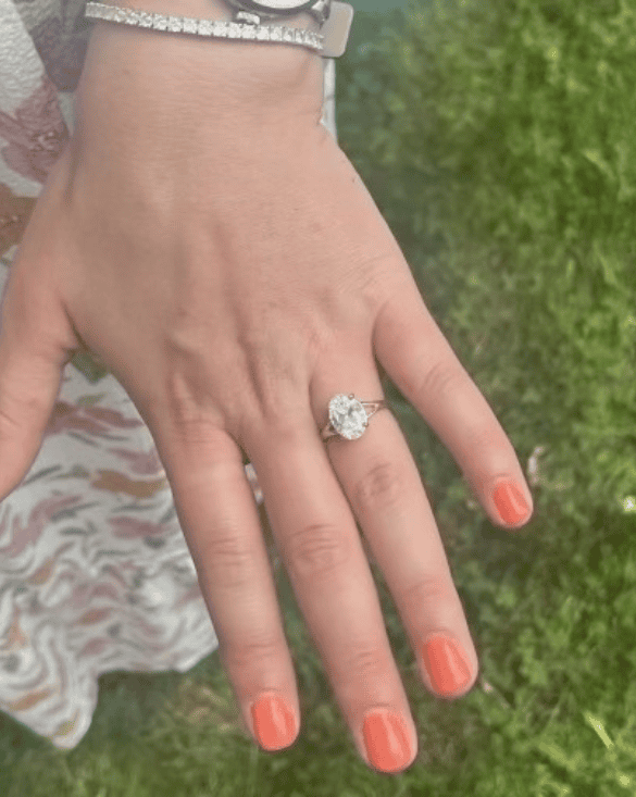 A person shows their Winter Jewelry diamond ring, shining with elegance and style for any special occasion.