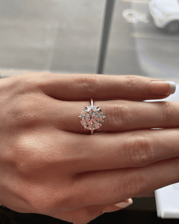 Winter Jewelry ring shown on manicured hand, highlighting its sparkling gemstone and elegant style.