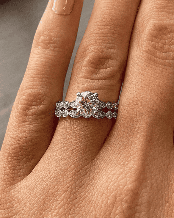 Winter Jewelry celebrates love with an eye-catching diamond engagement ring and wedding band, perfect for special moments.