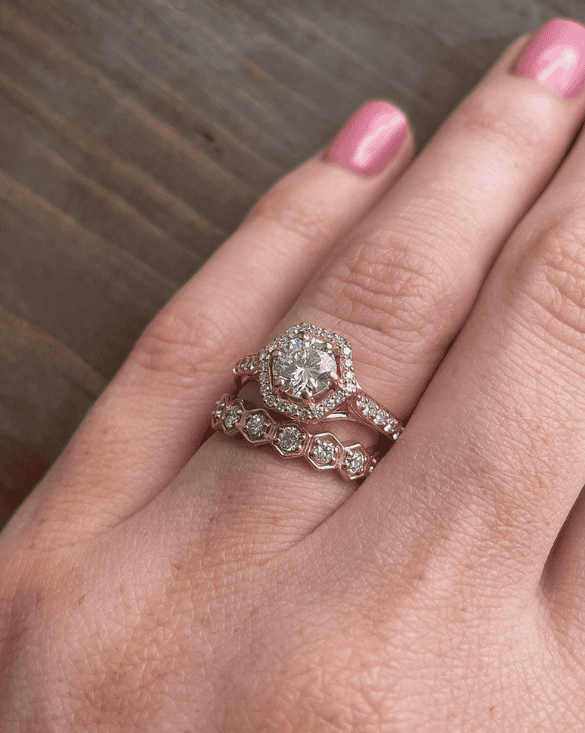 Winter Jewelry shows two diamond rings on a hand, sharing their beauty and style for shoppers in Williamsville, NY.