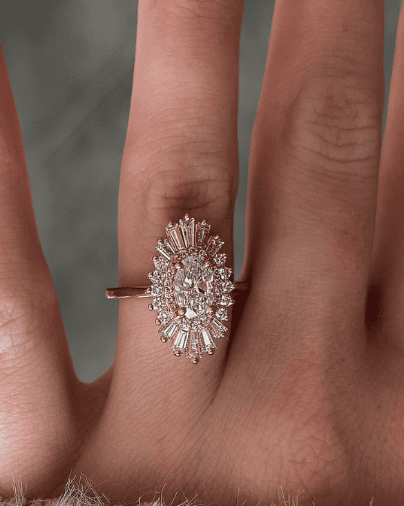 A hand shows a sparkling diamond ring from Winter Jewelry, highlighting its beauty and fine craftsmanship.