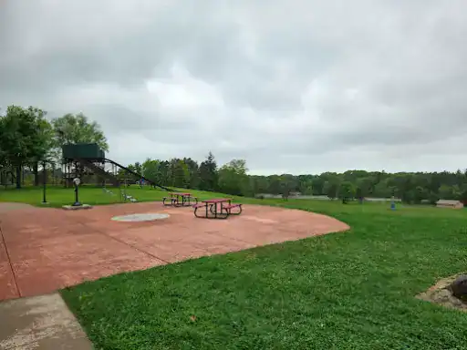 A peaceful park near Winter Jewelry in Williamsville, NY, offers a fun spot for families to relax and play together.